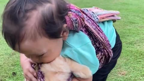 Toddler Has Unique Way Of Carrying Kitten Around