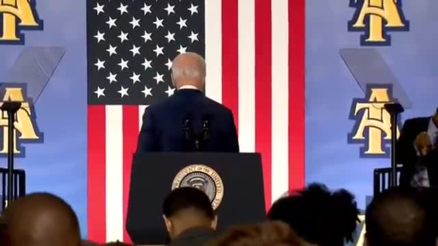 Biden shakes hands with invisible man