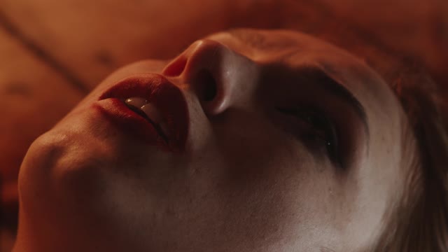 A woman lying on the ground feeling very sad and crying