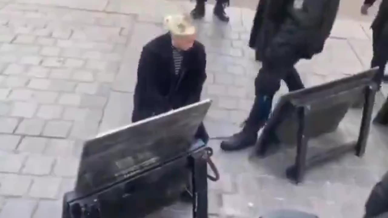 White woman kissing the shoes of negros