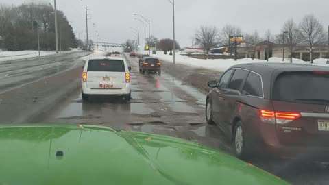 Wrecked Road Riddled with Problematic Potholes