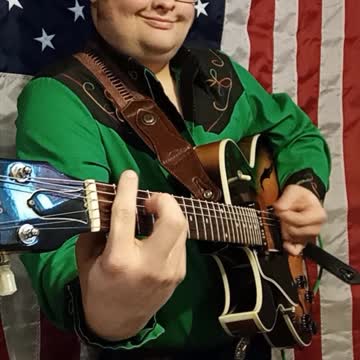 Trent Page plays guitar