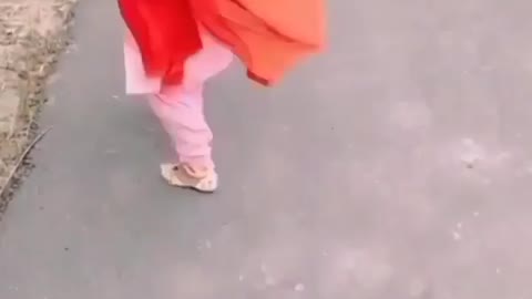 Cute baby girl on road side