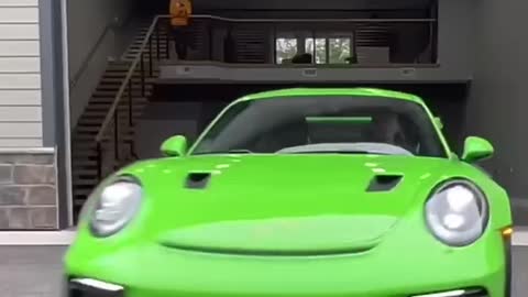 Exotic cars pulling out of Garage