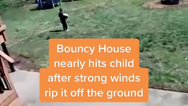 Bouncy House nearly hits child after strong winds rip it off the ground