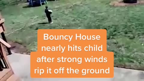 Bouncy House nearly hits child after strong winds rip it off the ground