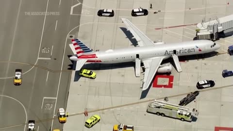 Smoking laptop in passenger's bag prompts evacuation on American Airlines