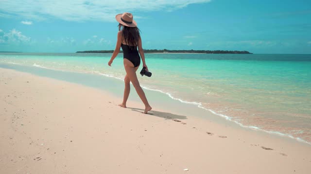 A Woman walking in the shore