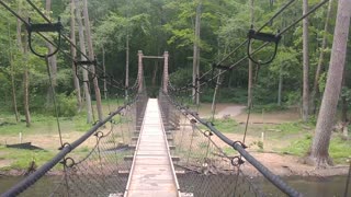 Crossing the suspension bridge along the trail at Mohican State Park