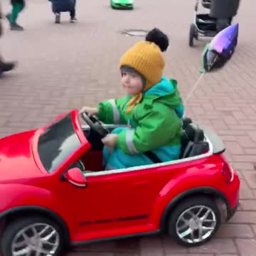 A child driving a car is very cute