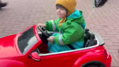 A child driving a car is very cute