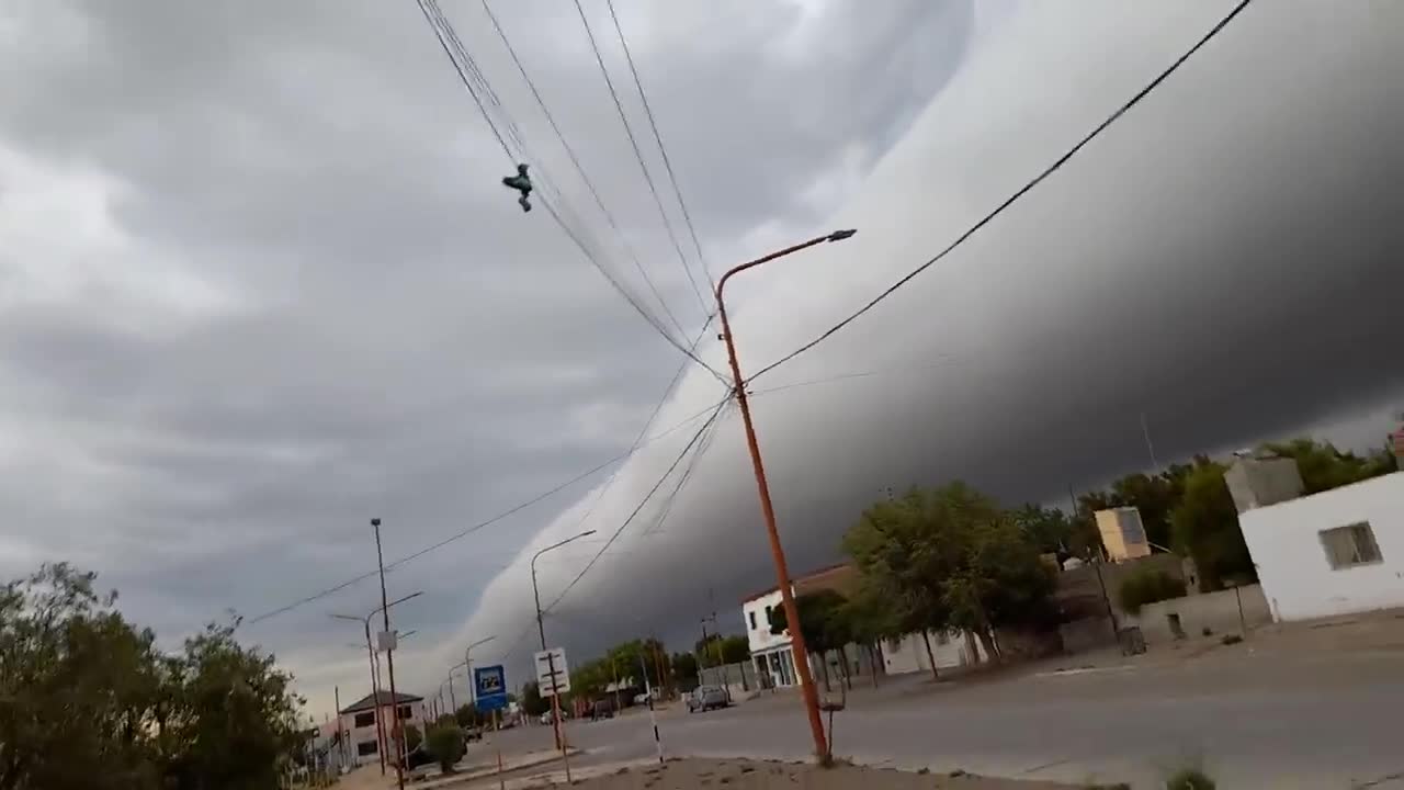 Strange storm cloud going through city.