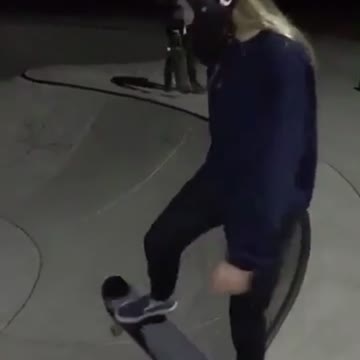 Girl blue sweater skating falls down