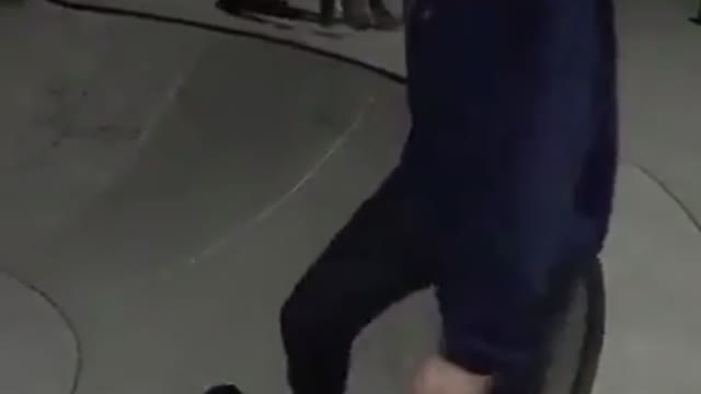 Girl blue sweater skating falls down