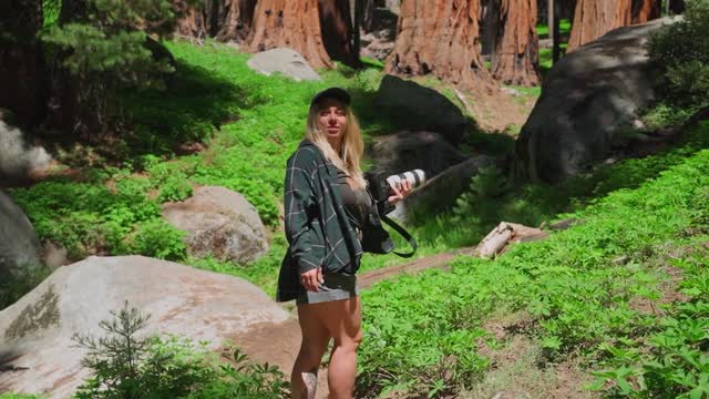 A Woman Looking the Nature while Walking in the Forest