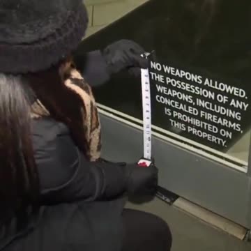Reporter Measures 'No Weapons Allowed' Sign After Mass Shooting, Finds It's Too Small