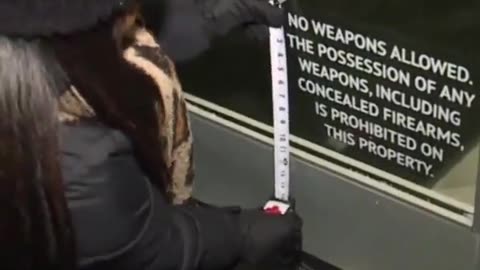 Reporter Measures 'No Weapons Allowed' Sign After Mass Shooting, Finds It's Too Small