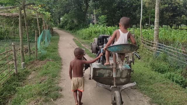 Two small boy vs power tiller driving video |