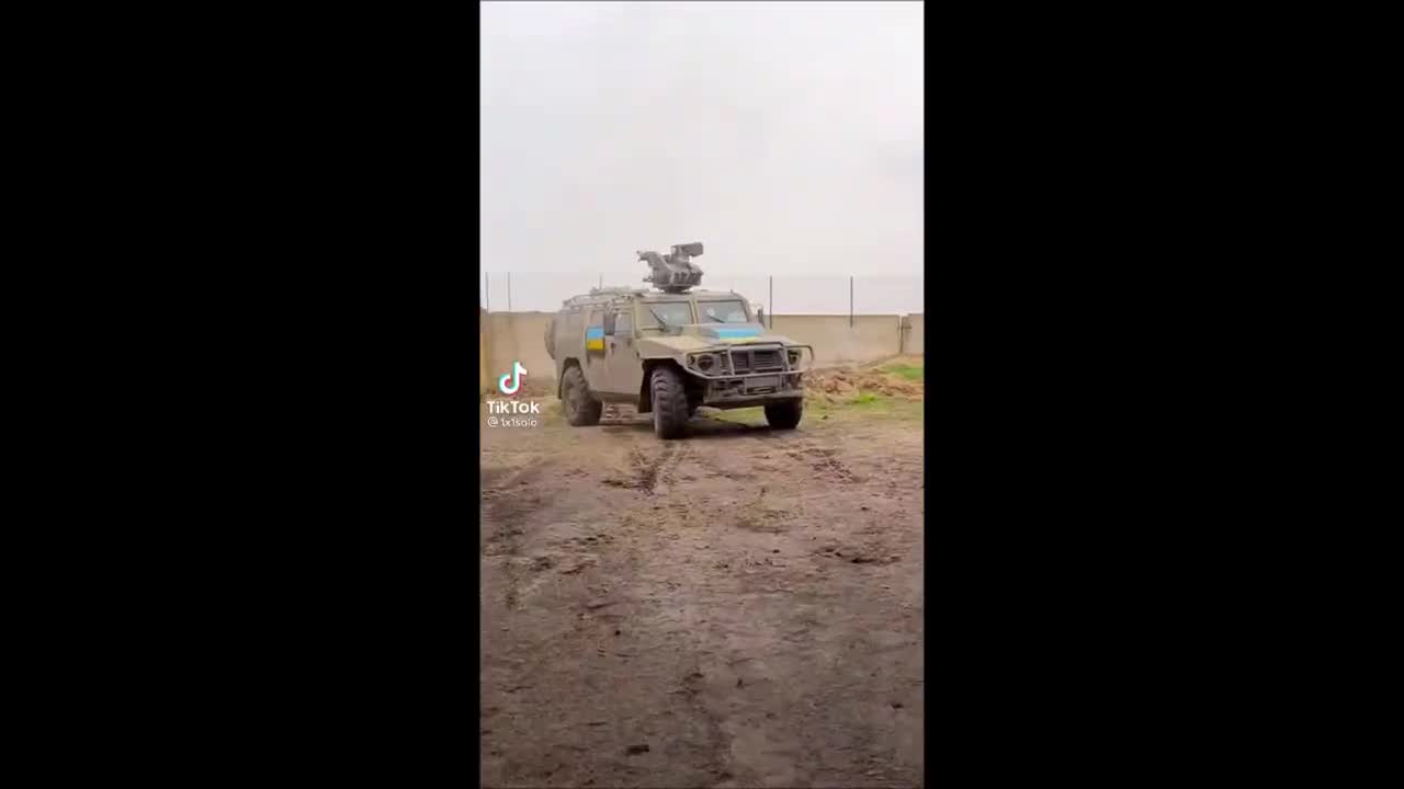 Russian APC Tigr-M Painted With Ukrainian Flag