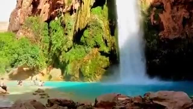 People Chilling At Beautiful waterfall