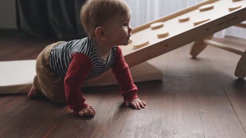 A Little Boy Crawling on the Floor