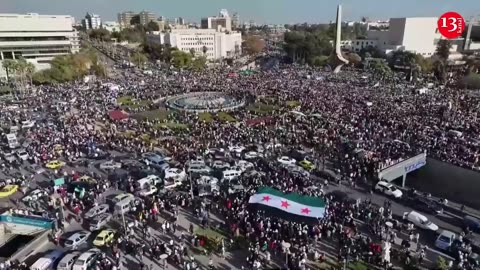 Aerial views show tens of thousands Syrians celebrating Assad's fall in central Damascus square