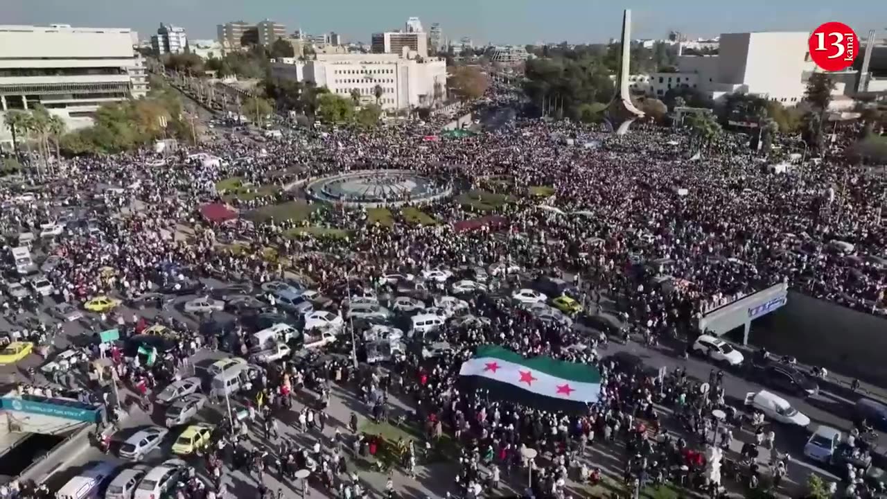 Aerial views show tens of thousands Syrians celebrating Assad's fall in central Damascus square