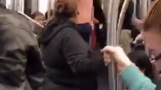 Shirtless guy pole dances in a nyc subway