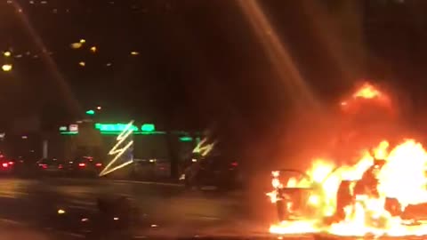 Flaming Car in the Street Combusts