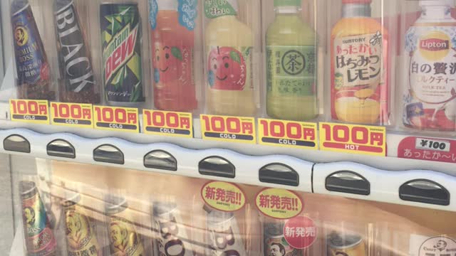 Buy coffee at a Japanese vending machine