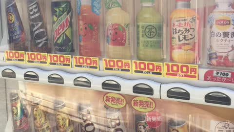 Buy coffee at a Japanese vending machine