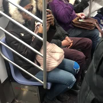 Man brushes his teeth on subway train