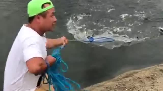 Fishing by net in small river