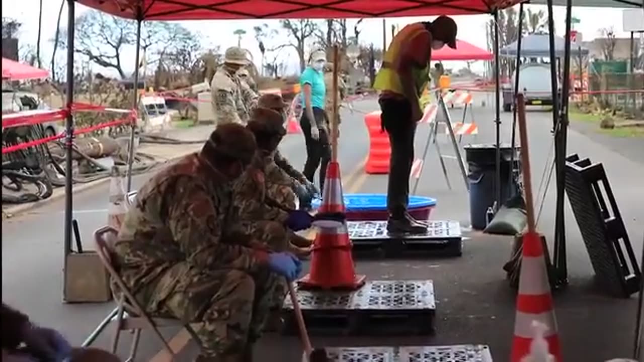 Military Decontaminating Each Other After Working On The Grounds of Lahaina Maui Hawaii