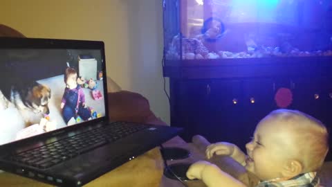 Baby laughing while watching TV