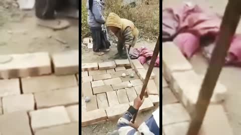 Adorable chinese children improvise pool with bricks and stones