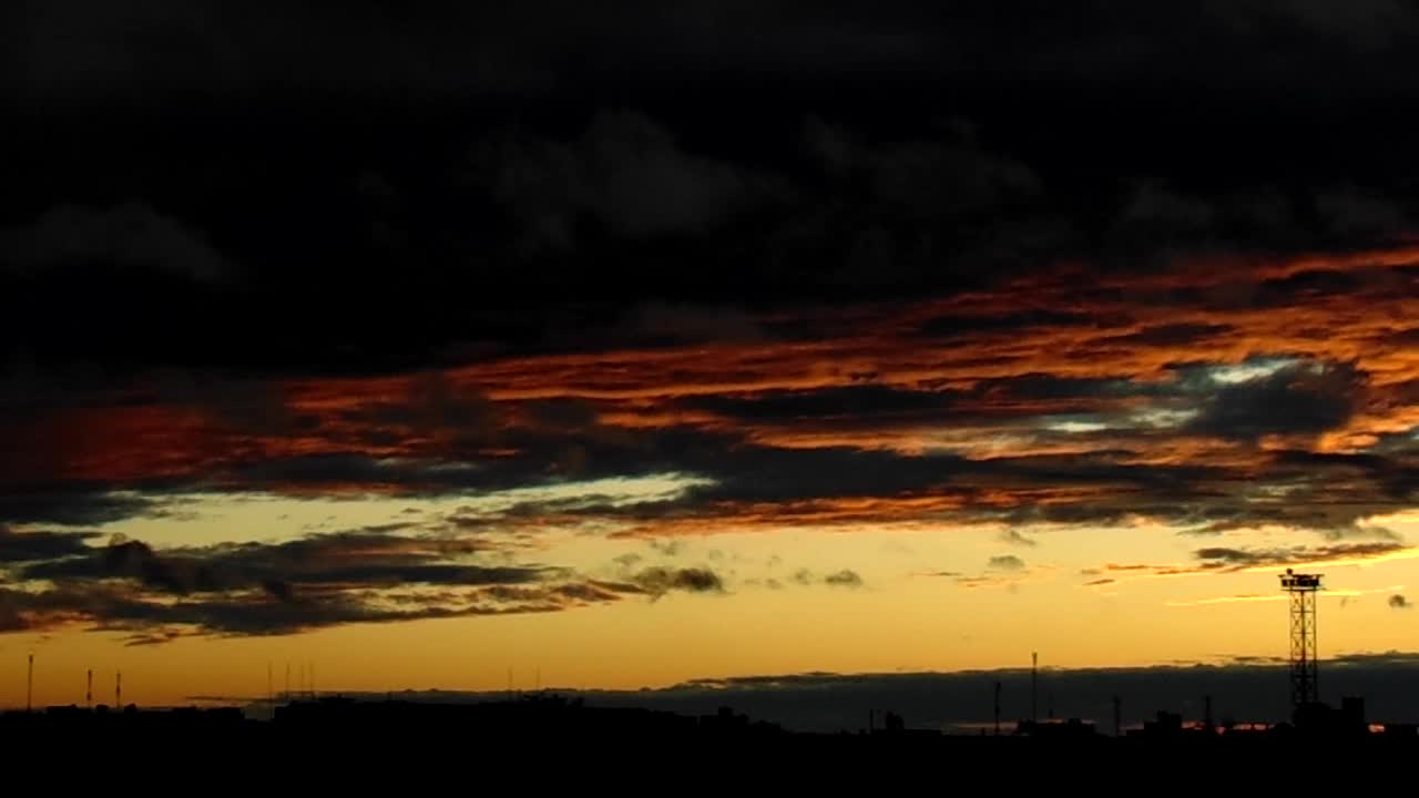 Unusual sunset against the background of thunderclouds