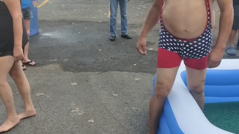 Brother vs sister in a pool of jello wrestling match