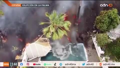 Lava from the Cumbre Vieja volcano devours houses and roads as it passes