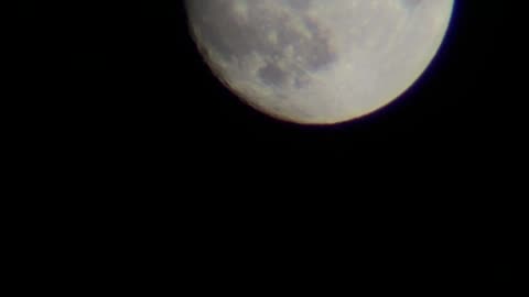 Airplane Silhouetted Against Full Moon: A Rare Moment Captured