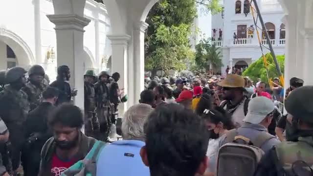 Sri Lankans have stormed and taken over the Prime Minister's office, the army has stood down.