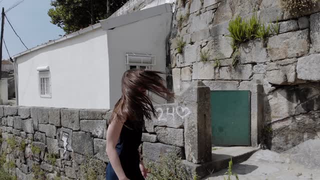 Beautiful woman dancing in the street