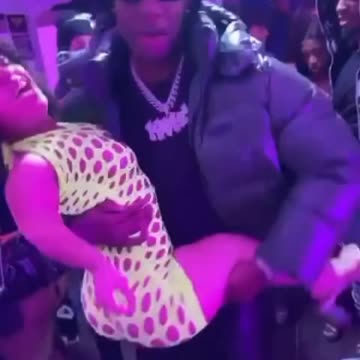 Rob49 out here going crazy in the club with a little person