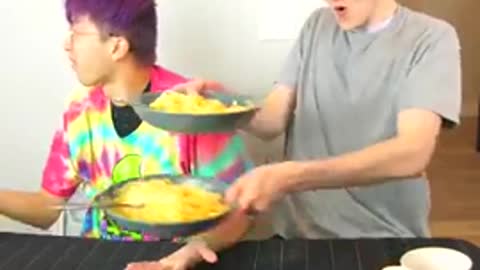 Funy guys competing each other with eating pasta (Cute Video)