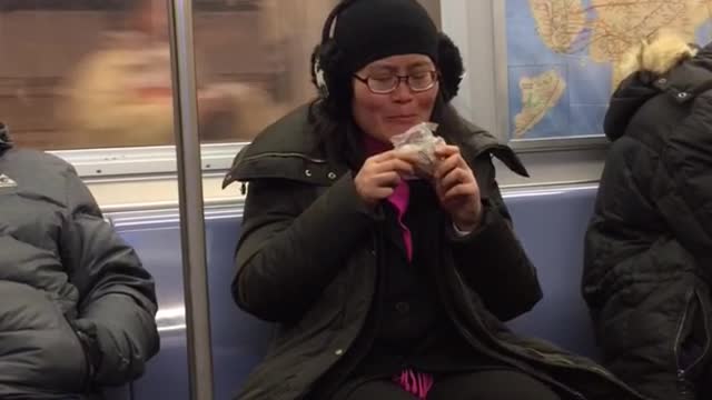 Woman eats out of plastic bag but cant reach the food