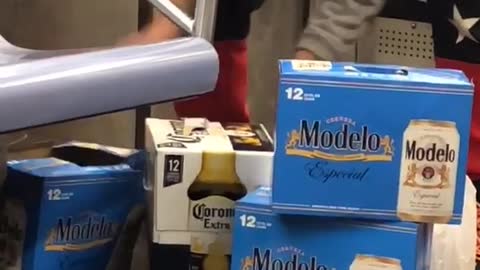 Man packing up three beer packs in subway