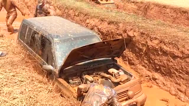 Broken car inside mud hole