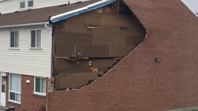 Wind Rips Down Brick Wall