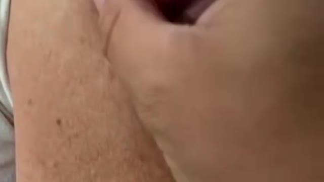 Another magnet sticks to this womans arm where she got the Pfizer vaccine done