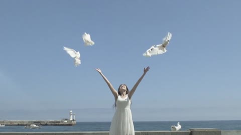 Happy Woman Releasing A Pigeons